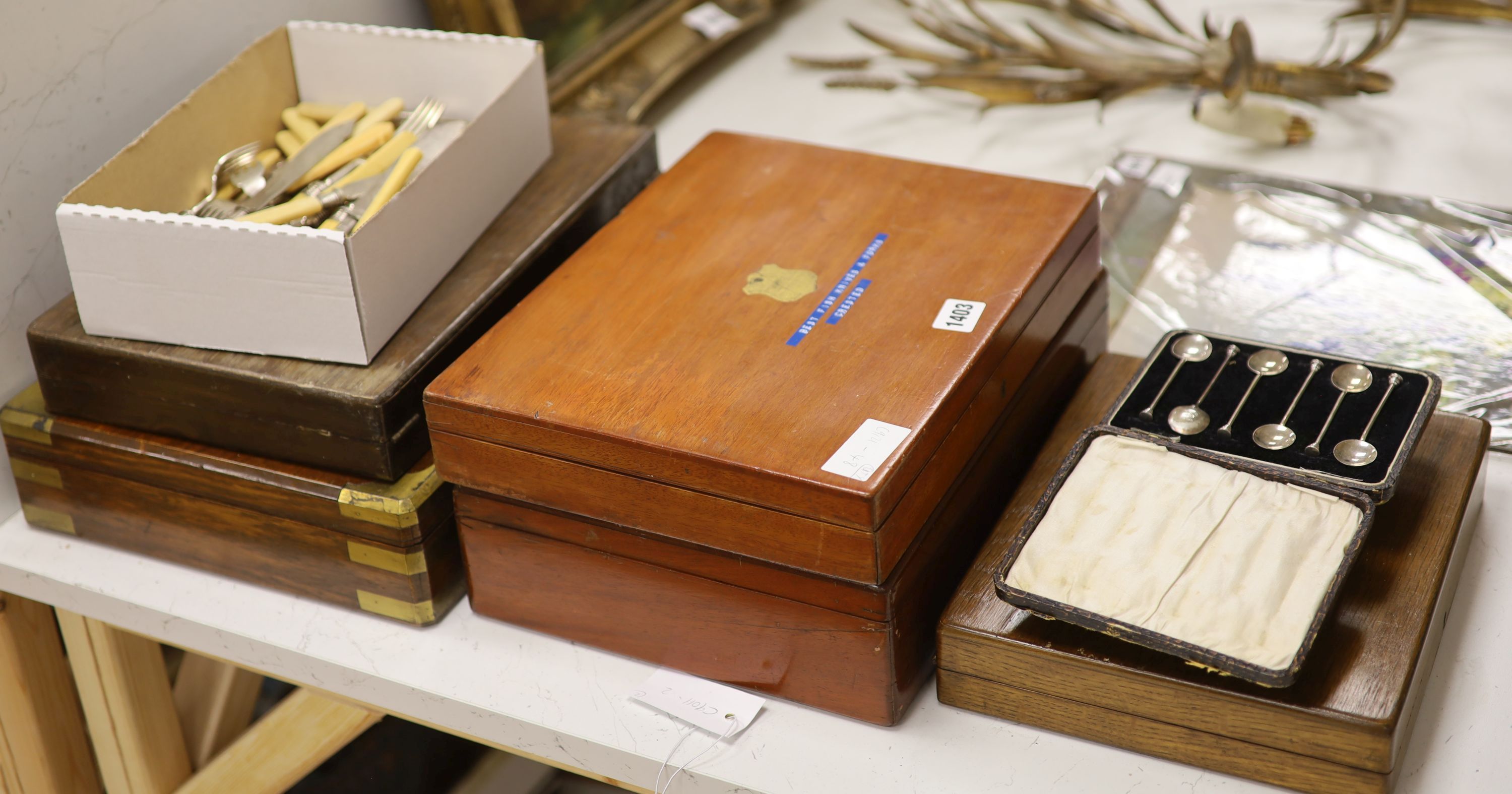 Three boxes of mixed fish eaters and flatware and two boxes of silver teaspoons and silver knives and forks.